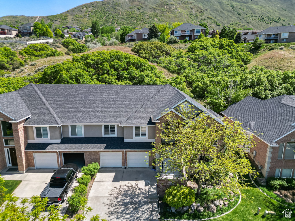 Aerial perspective of suburban area featuring a mountain backdrop