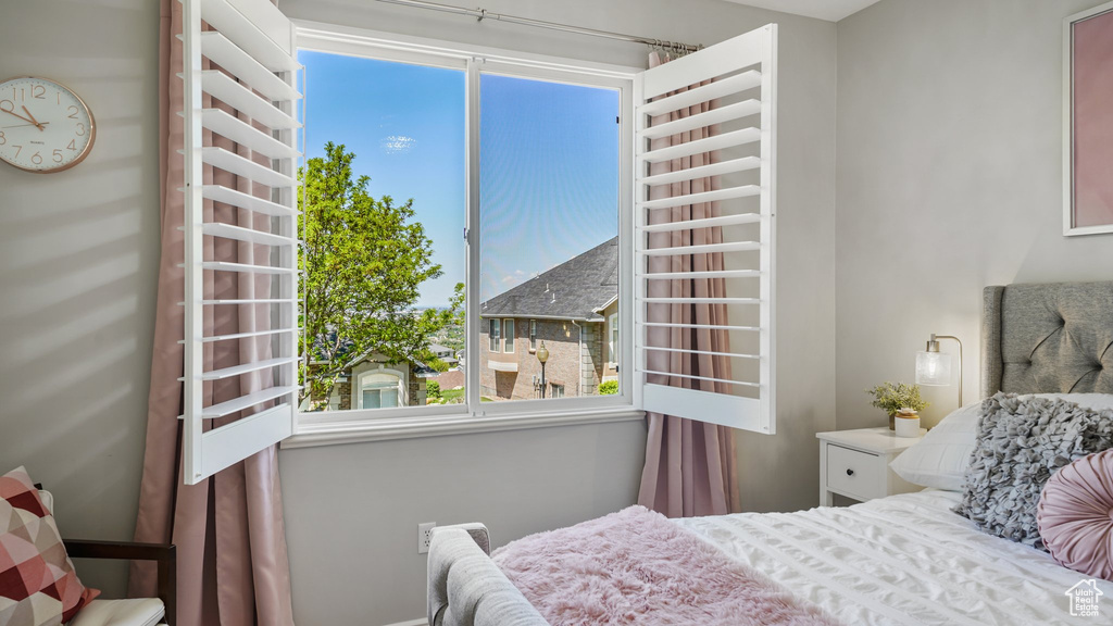 Bedroom with multiple windows