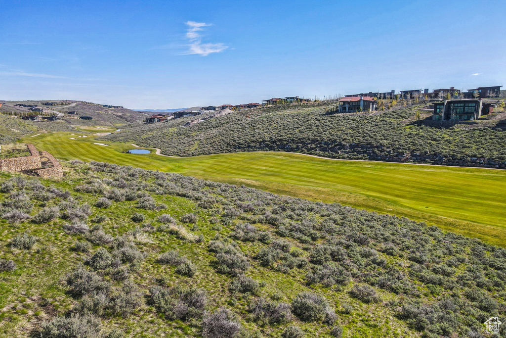 View of property's community featuring view of golf course and a water view