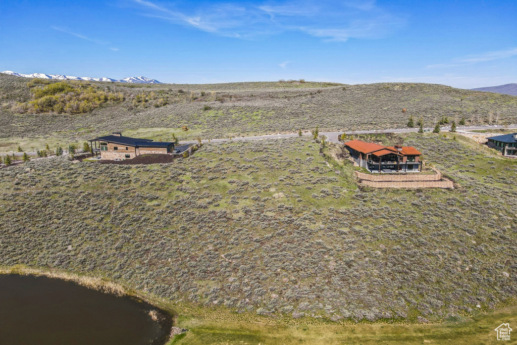 View of property location with a water and mountain view