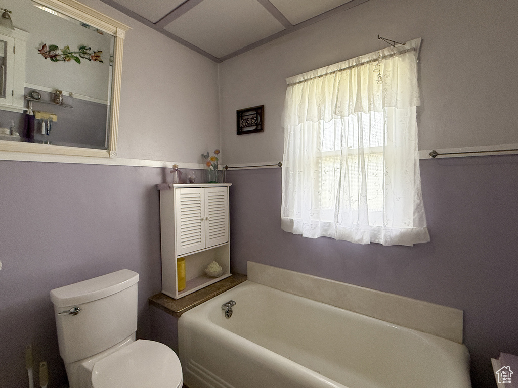 Bathroom with a bath and toilet