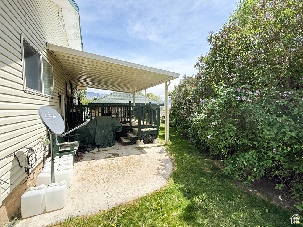 View of patio featuring a wooden deck