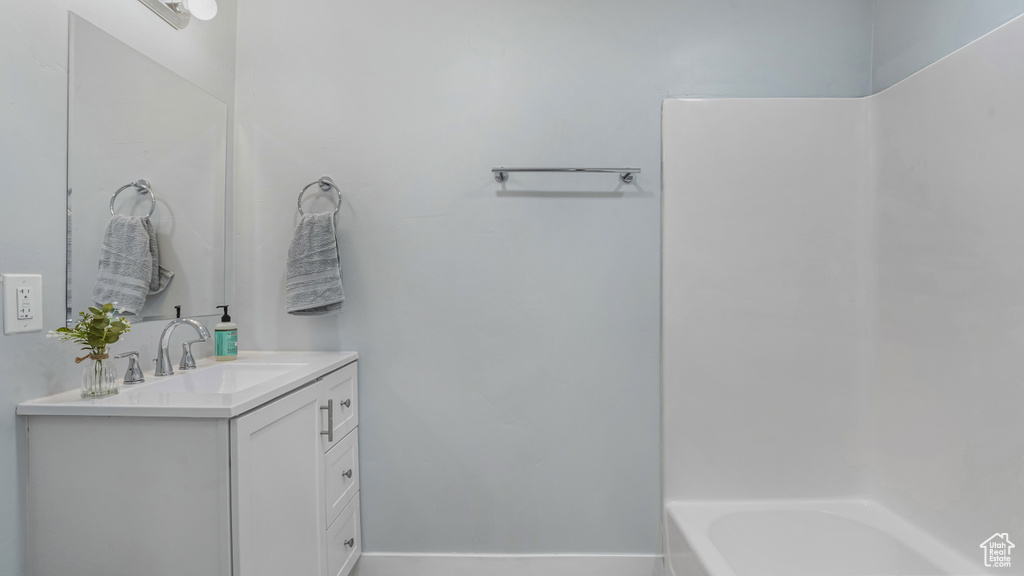 Bathroom with vanity and baseboards