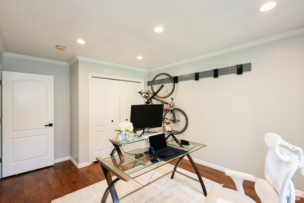 Office space featuring wood finished floors, baseboards, recessed lighting, and ornamental molding