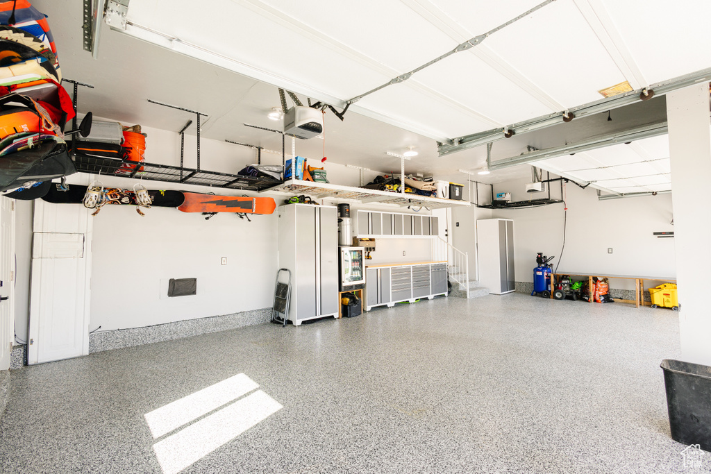 Garage featuring a garage door opener