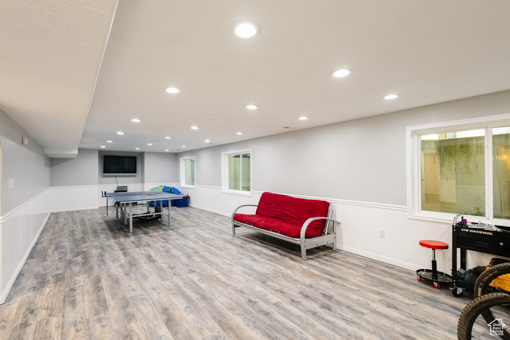 Rec room featuring wood finished floors, recessed lighting, and baseboards