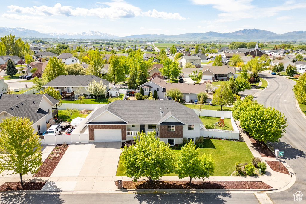 Aerial view of residential area featuring a mountainous background