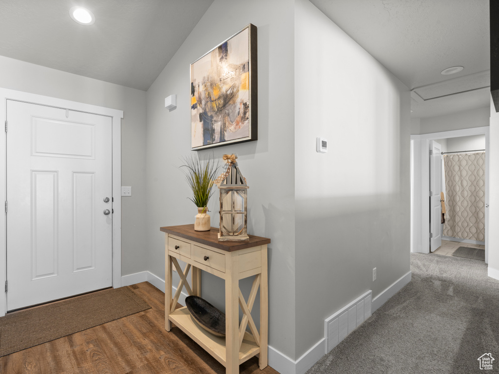 Foyer featuring baseboards and recessed lighting
