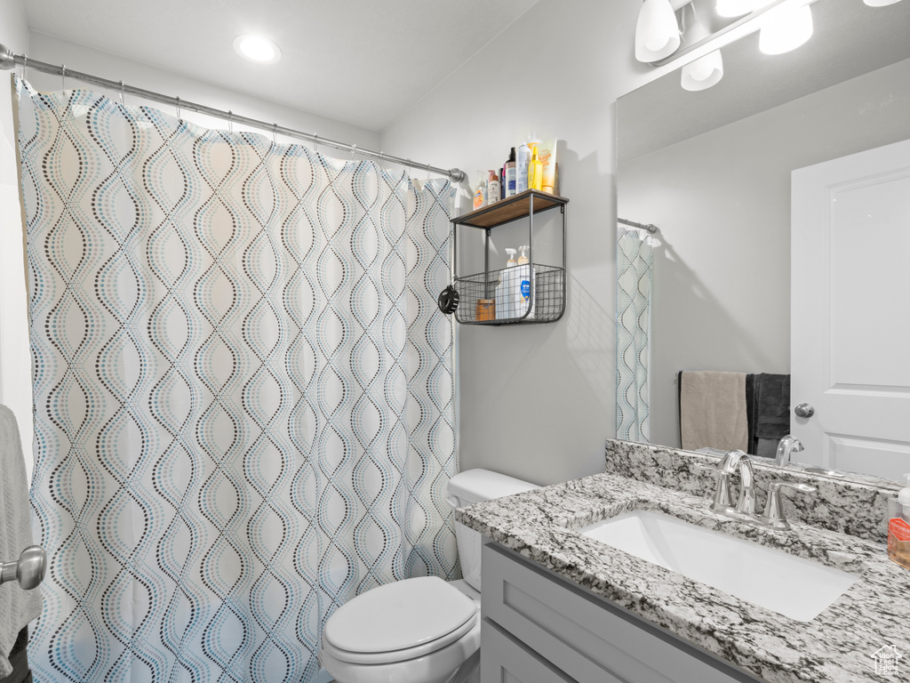 Bathroom featuring toilet and vanity