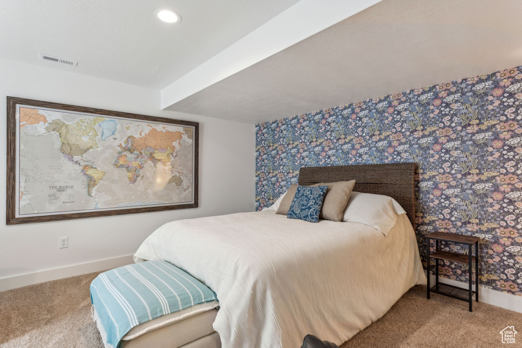 Bedroom with carpet floors, baseboards, wallpapered walls, and recessed lighting