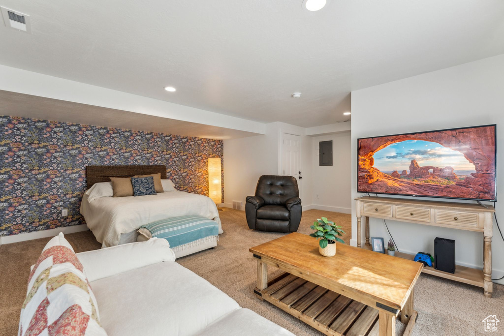 Bedroom featuring light colored carpet, recessed lighting, baseboards, and electric panel