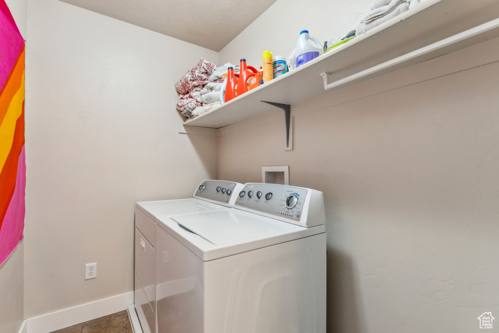Clothes washing area with independent washer and dryer and baseboards
