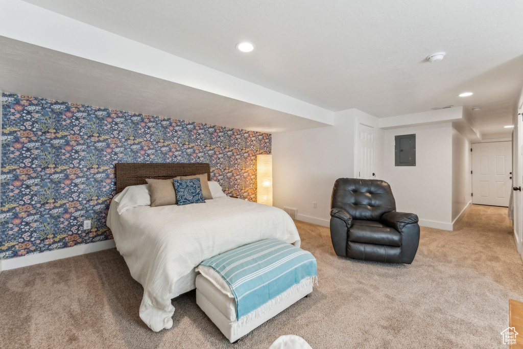Bedroom with electric panel, carpet, baseboards, and recessed lighting