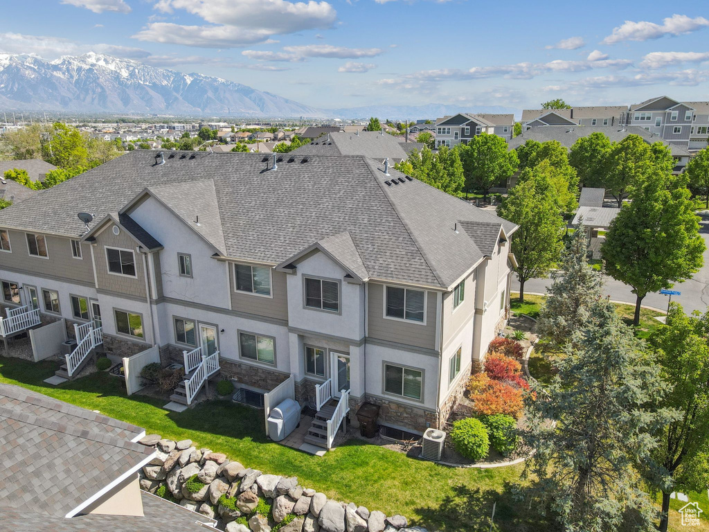 Aerial perspective of suburban area with a mountainous background