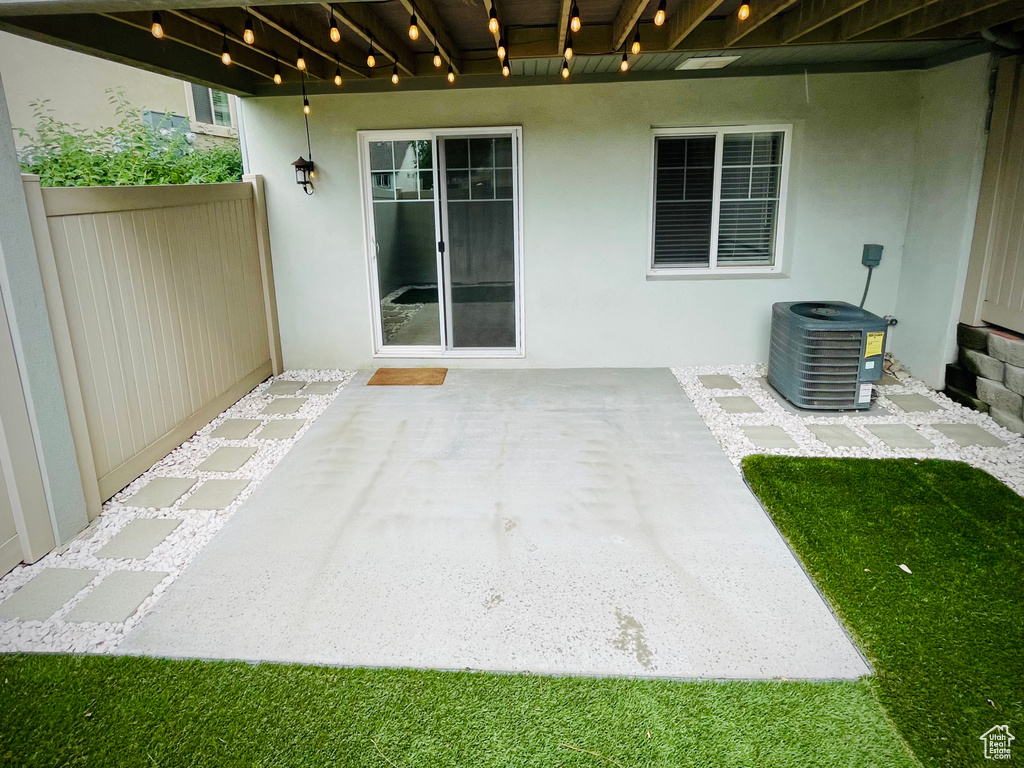 View of patio / terrace with central air condition unit and fence