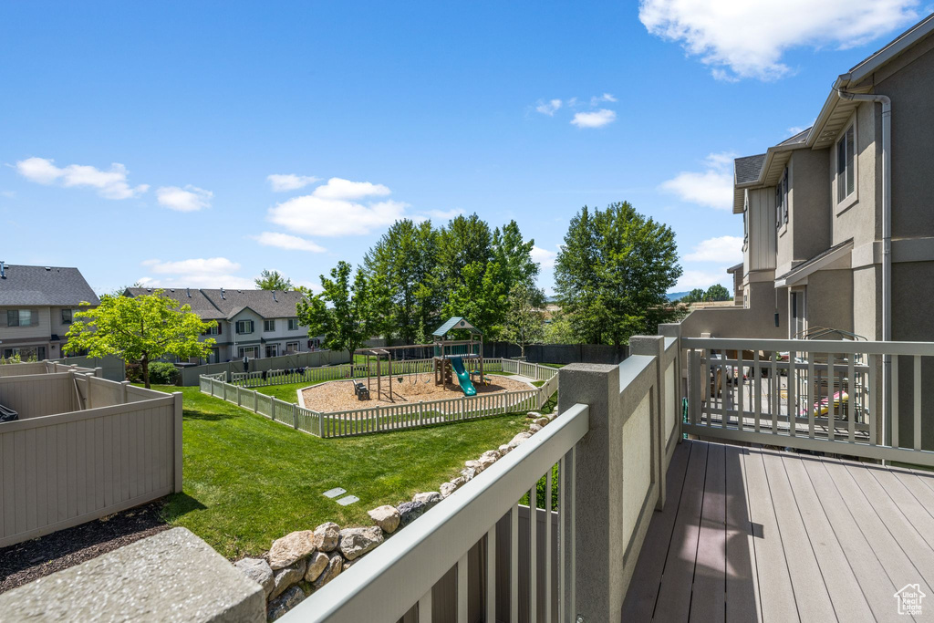 View of wooden balcony featuring a residential view and a wooden deck