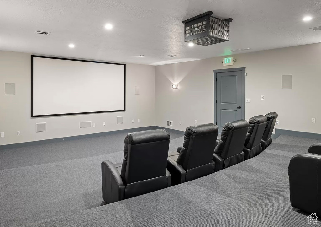 Home theater with baseboards and recessed lighting