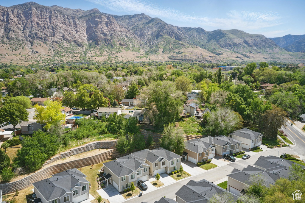 View of property location featuring nearby suburban area and a mountain backdrop