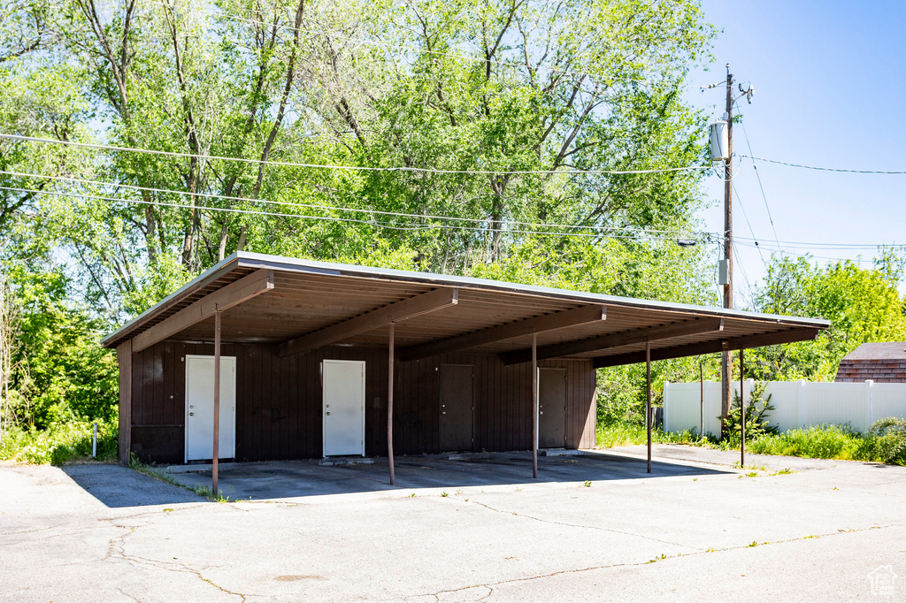 Covered parking lot with fence