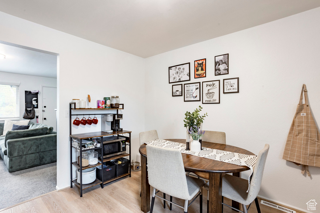 Dining space with light wood-style flooring
