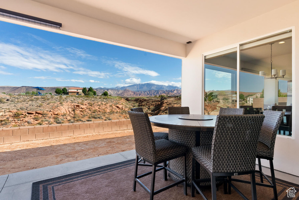 View of patio / terrace with a mountain view and outdoor dining space