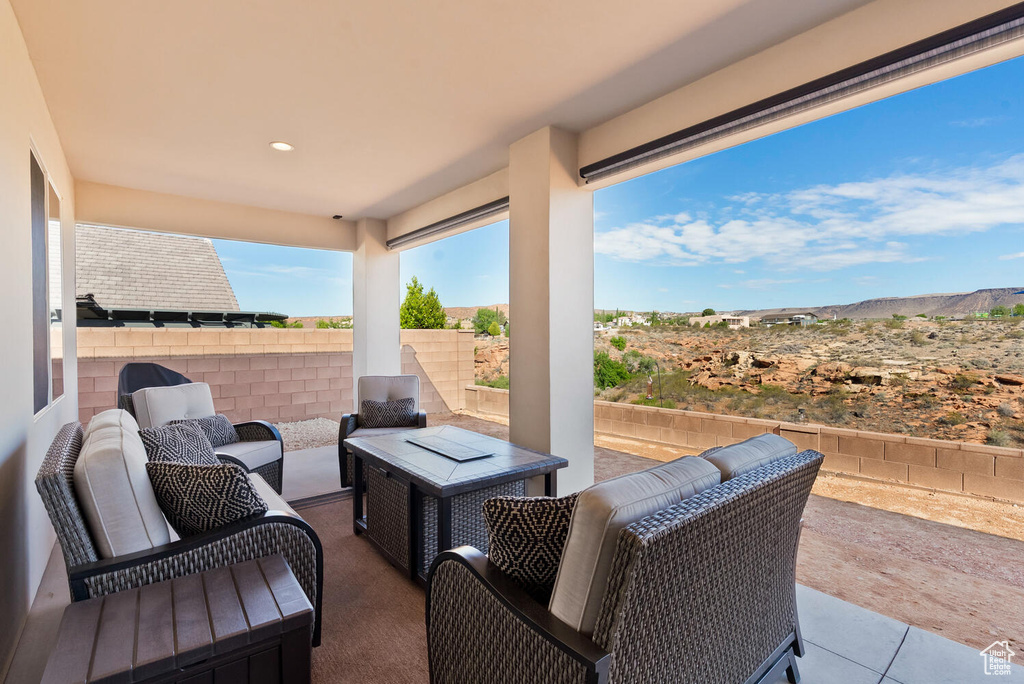 View of patio / terrace featuring an outdoor hangout area and a mountain view