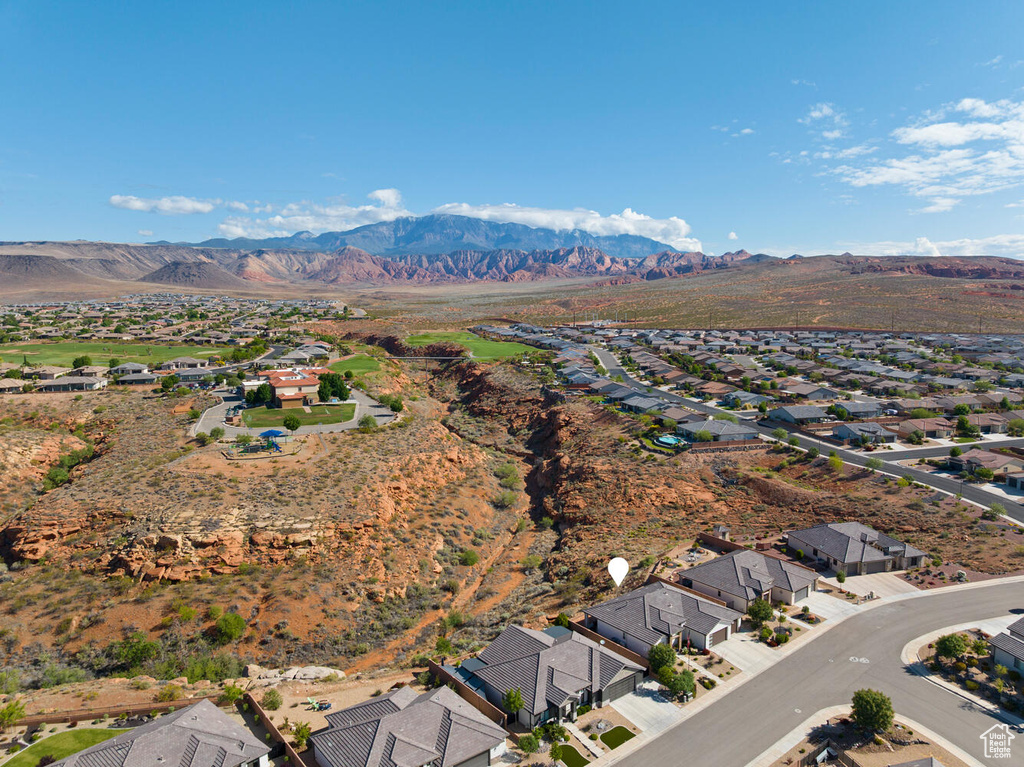 View of property location featuring nearby suburban area and a mountainous background