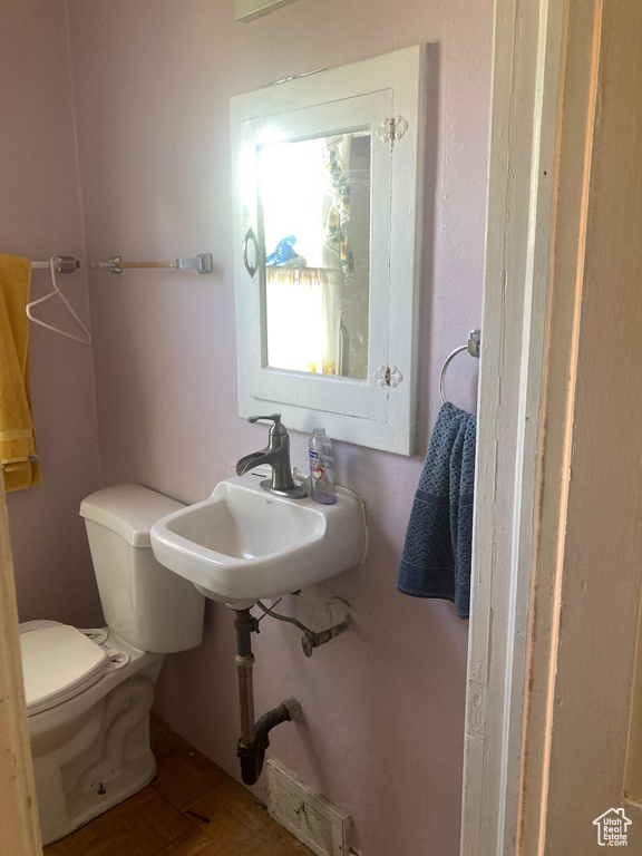 Bathroom with toilet and a sink