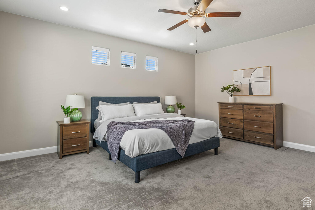 Bedroom featuring light carpet, baseboards, recessed lighting, and ceiling fan