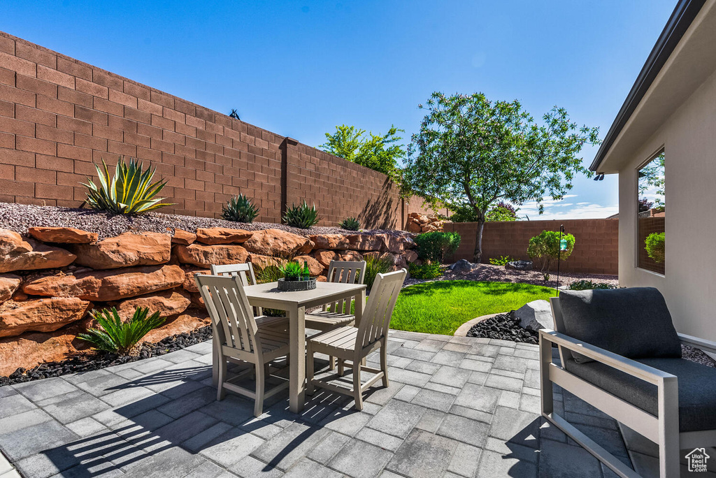 View of patio / terrace with outdoor dining space and a fenced backyard