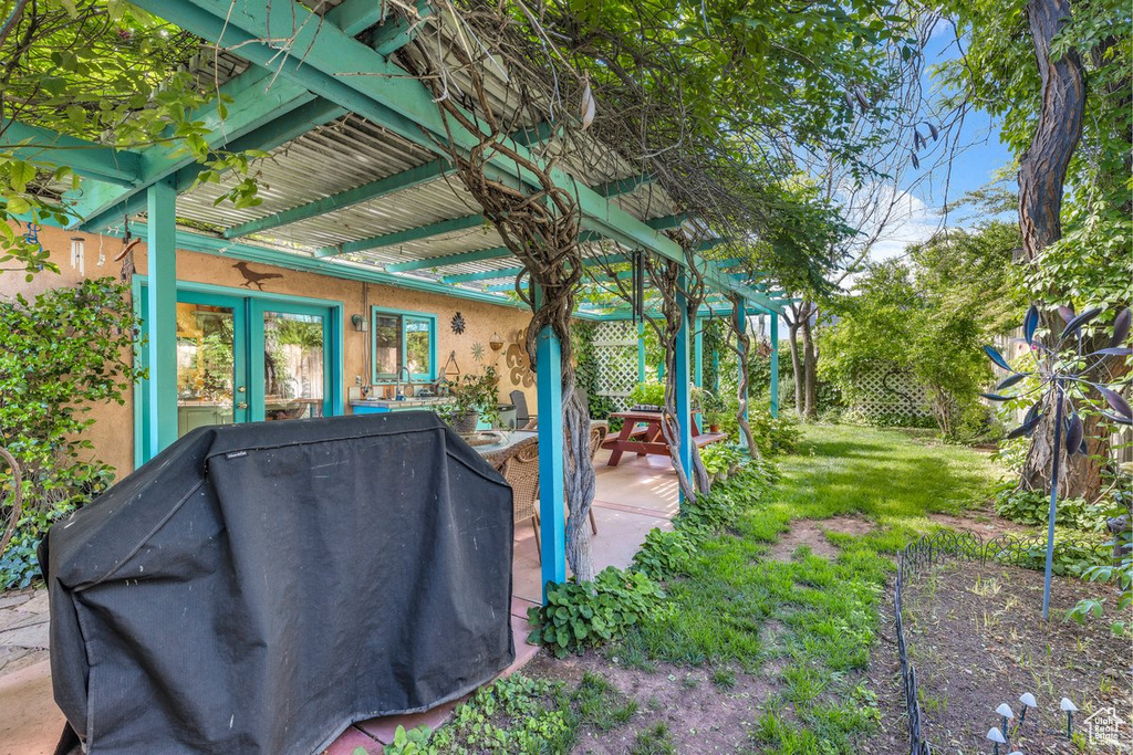 View of patio / terrace featuring a grill and a pergola