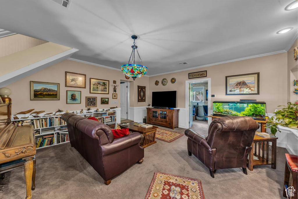 Living room with carpet flooring, ornamental molding, a wainscoted wall, and recessed lighting