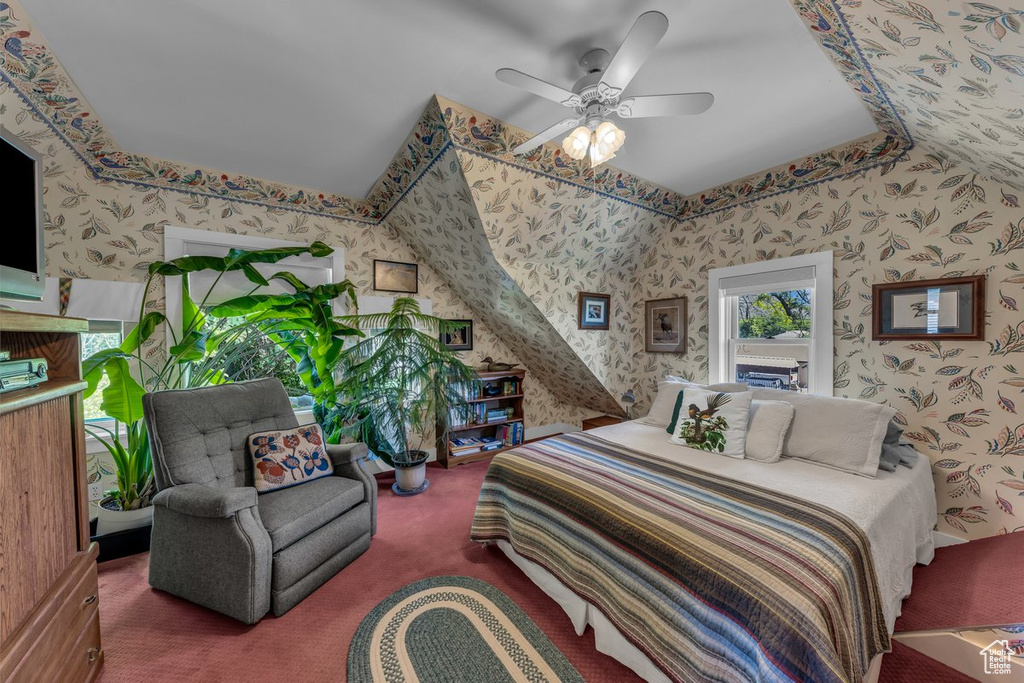 Carpeted bedroom with wallpapered walls