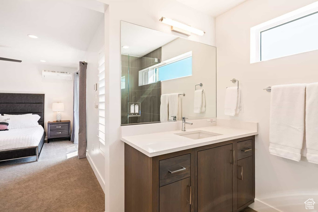 Ensuite bathroom with an enclosed shower and vanity