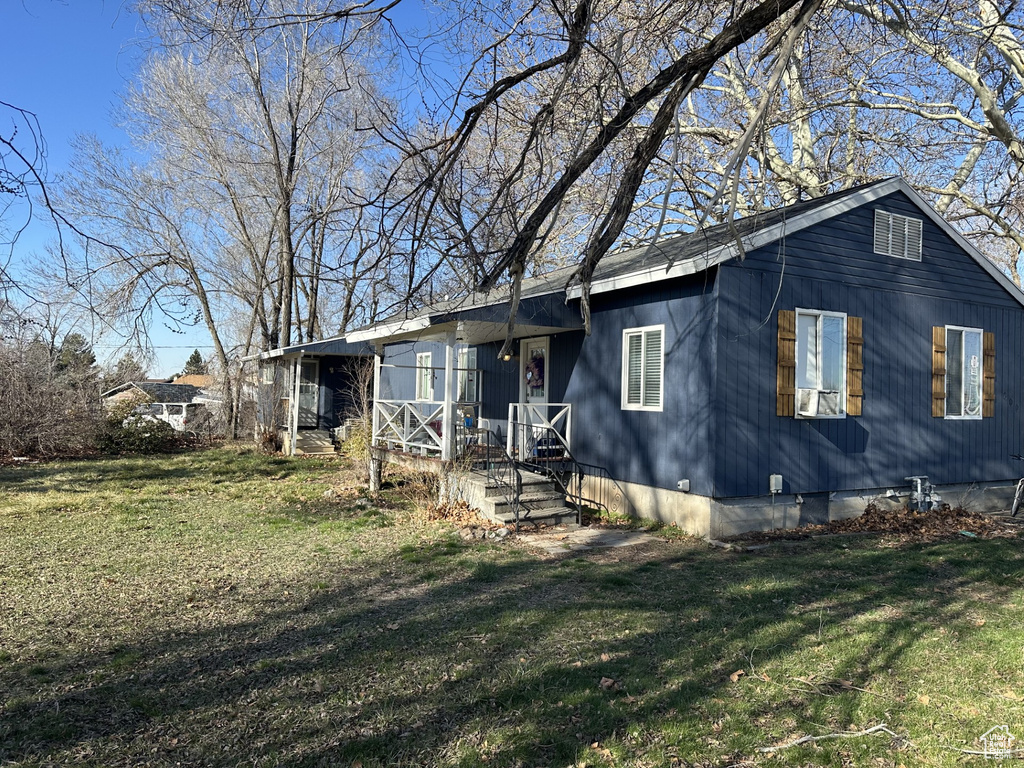 View of front of property featuring a front yard and crawl space