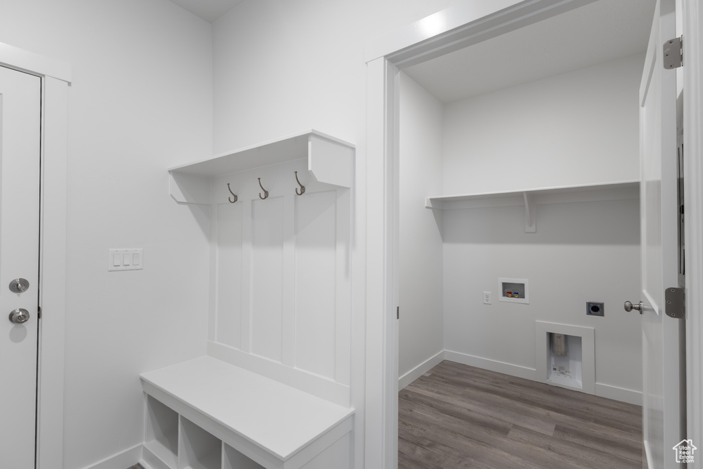 Mudroom featuring wood finished floors and baseboards