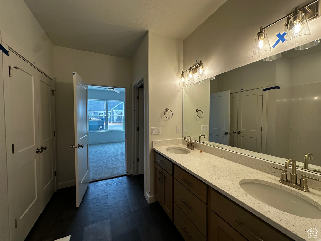 Full bathroom with double vanity and tile patterned floors