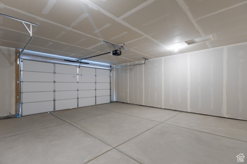 Garage featuring a garage door opener