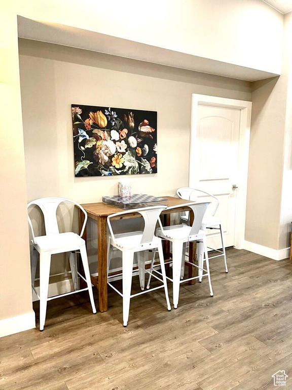 Dining room featuring baseboards and wood finished floors