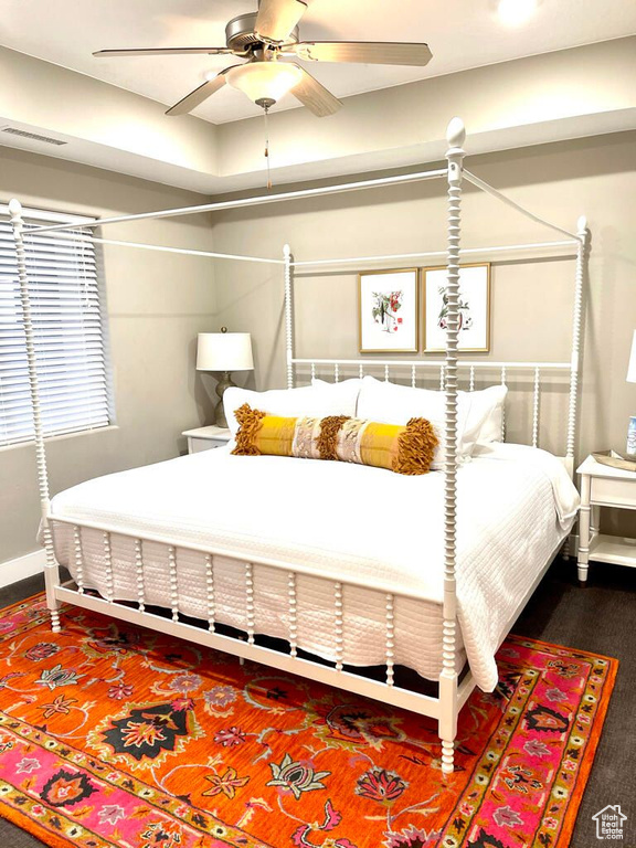 Bedroom featuring baseboards and visible vents