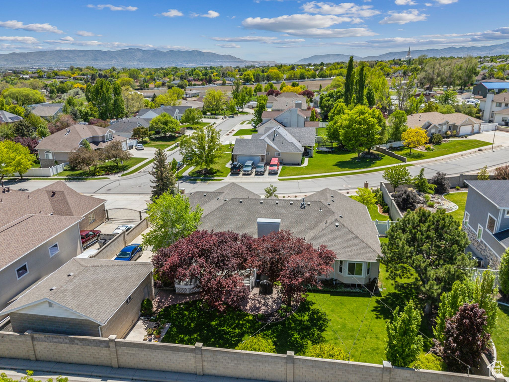 Aerial view of residential area featuring a mountainous background