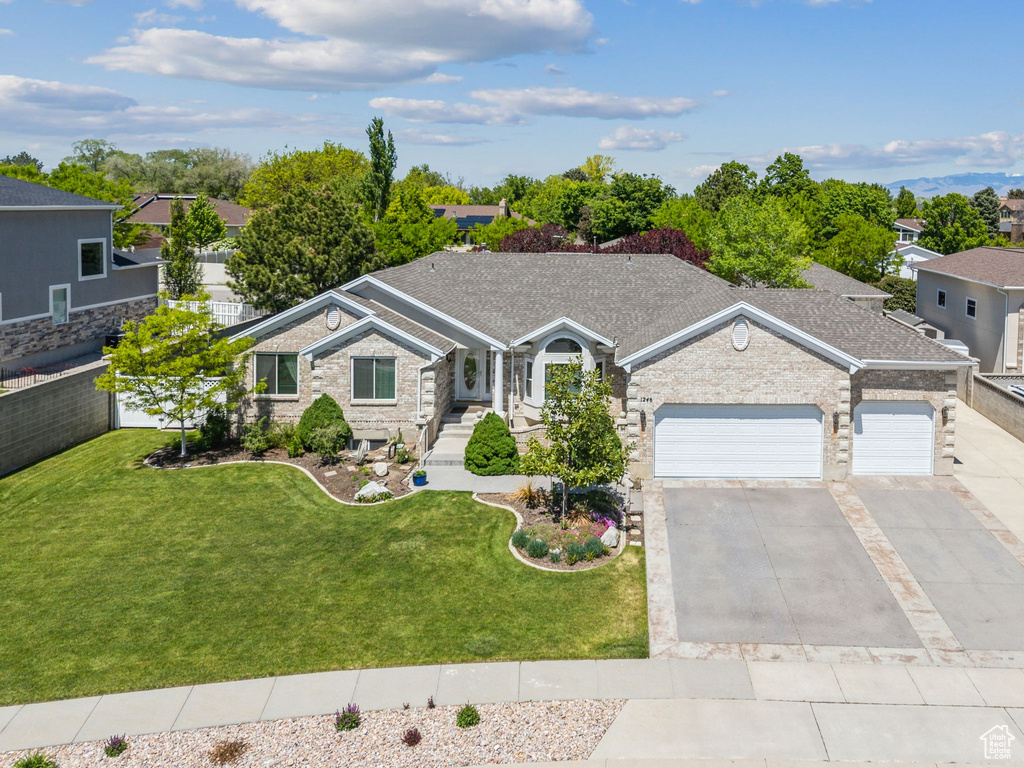 Single story home with a garage and driveway