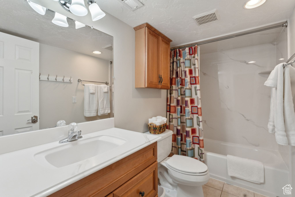 Bathroom featuring shower / bath combo with shower curtain, toilet, tile patterned floors, vanity, and recessed lighting