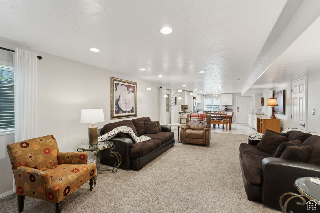 Living room with recessed lighting and light carpet