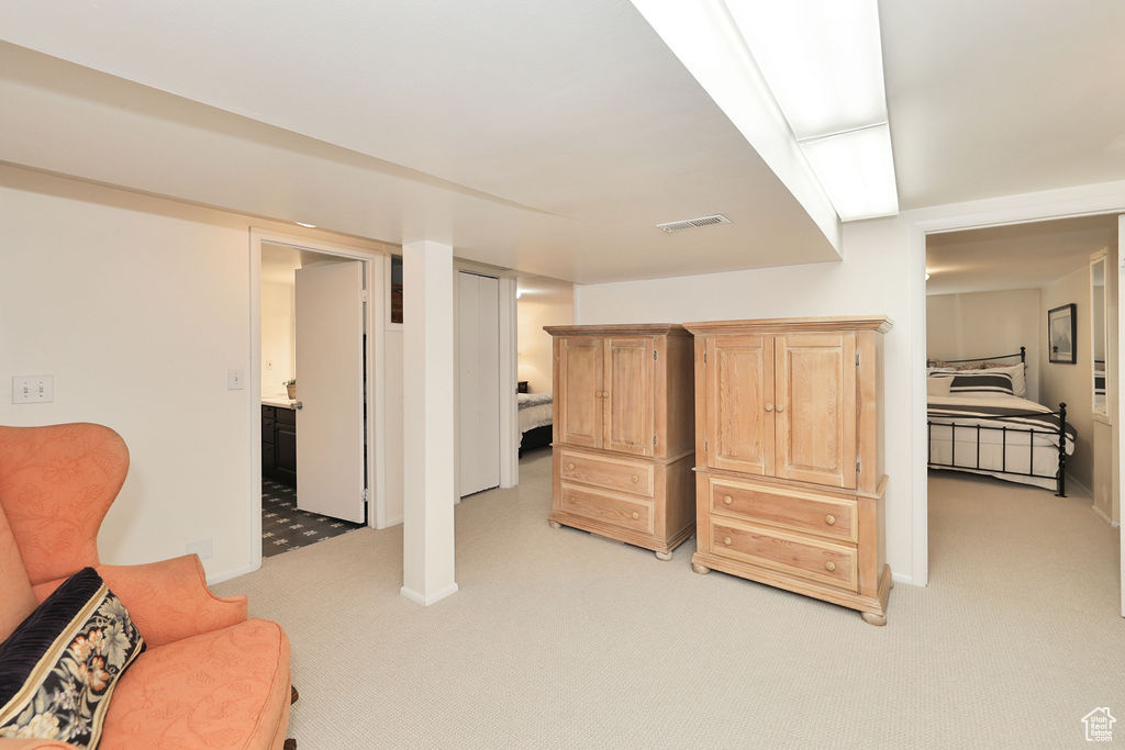 Living area with light colored carpet