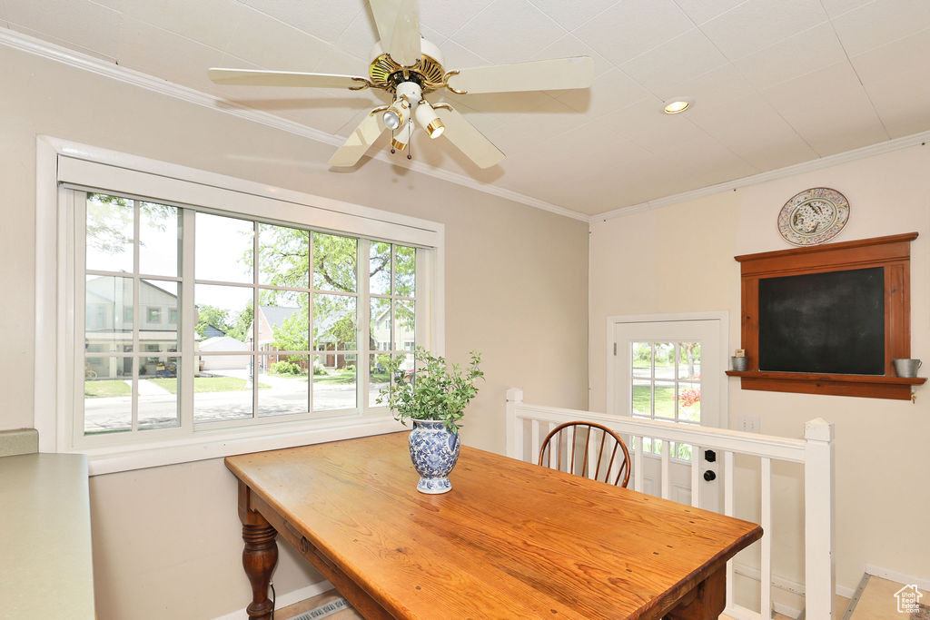 Dining area with plenty of natural light, baseboards, crown molding, ceiling fan, and recessed lighting