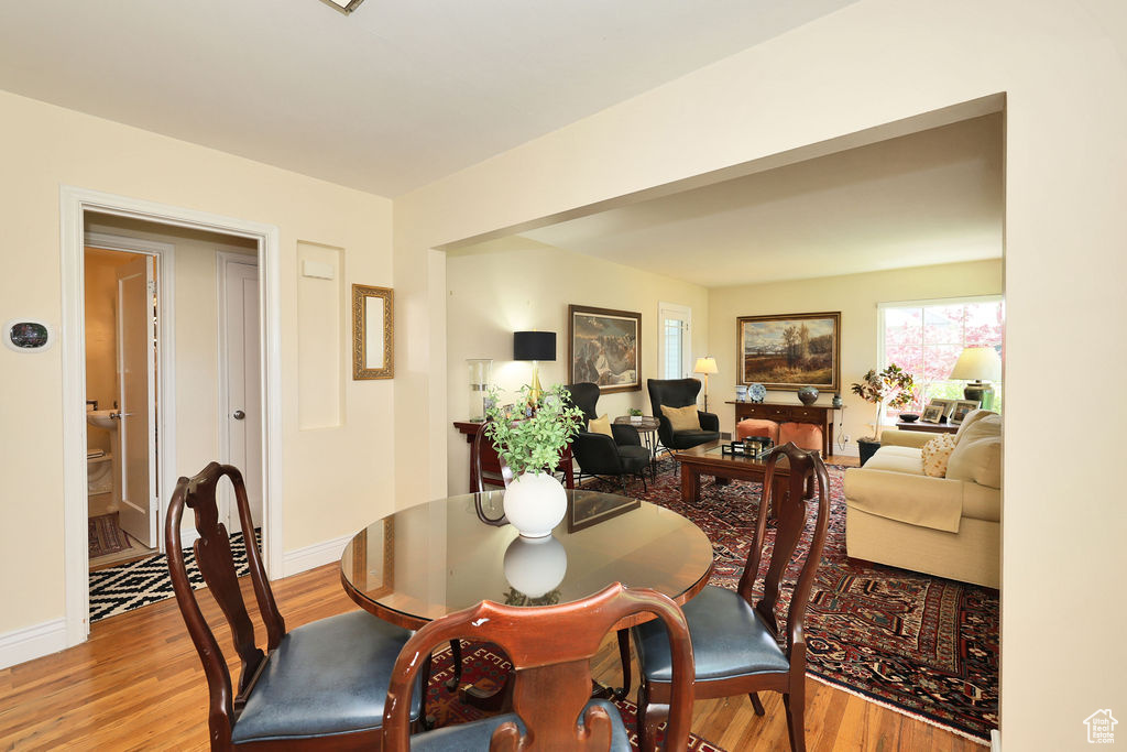Dining room featuring light wood-style floors and baseboards