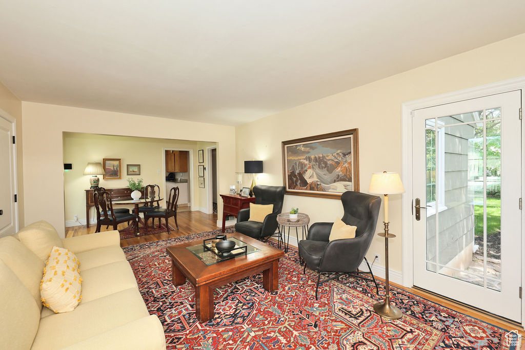 Living room with wood finished floors and baseboards