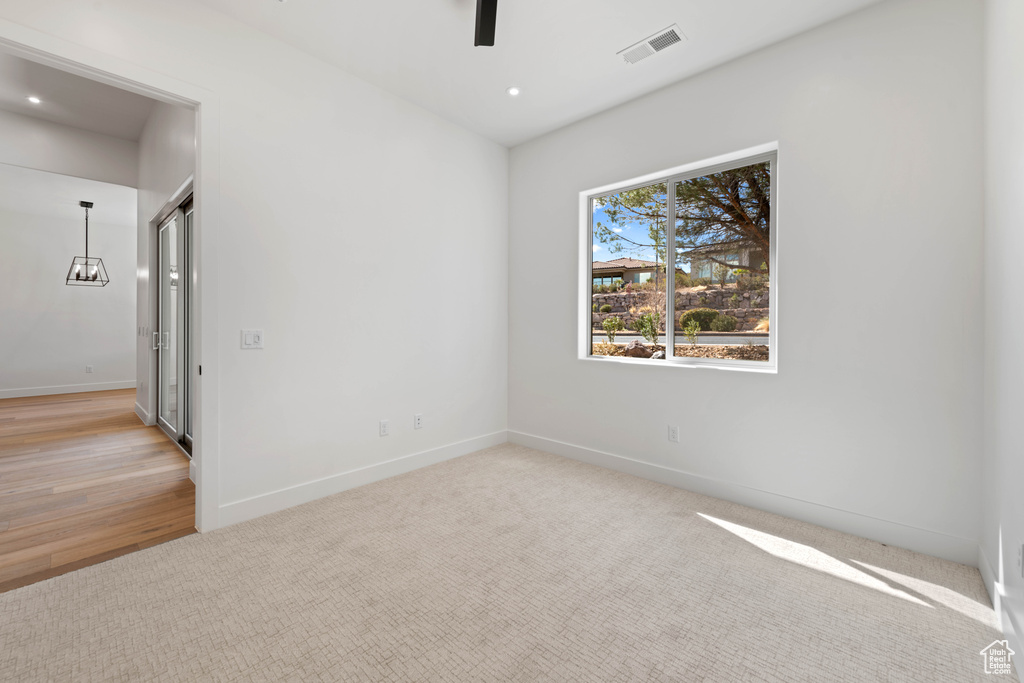 Spare room with baseboards, ceiling fan, carpet, and recessed lighting