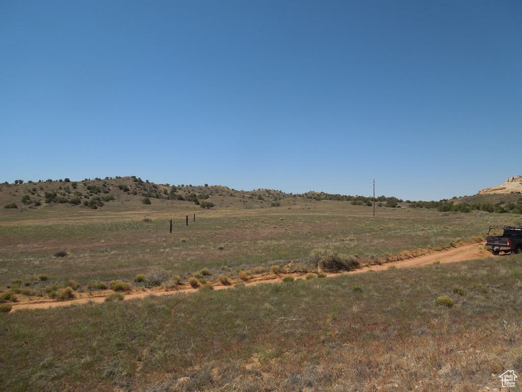 View of yard with a rural view